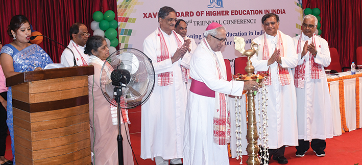 Archbishop Thomas D'Souza lighting the lamp to inaugurate the Triennial Conference